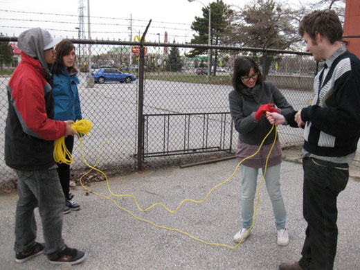 Immony, Michelle, Danielle, and Steven begin sorting out the 100 feet of rope we'll use in the fence