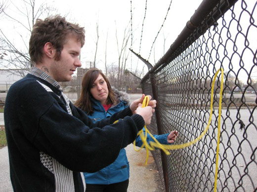 Steven and Michelle work out the logistics of the rope in the fence to create the R