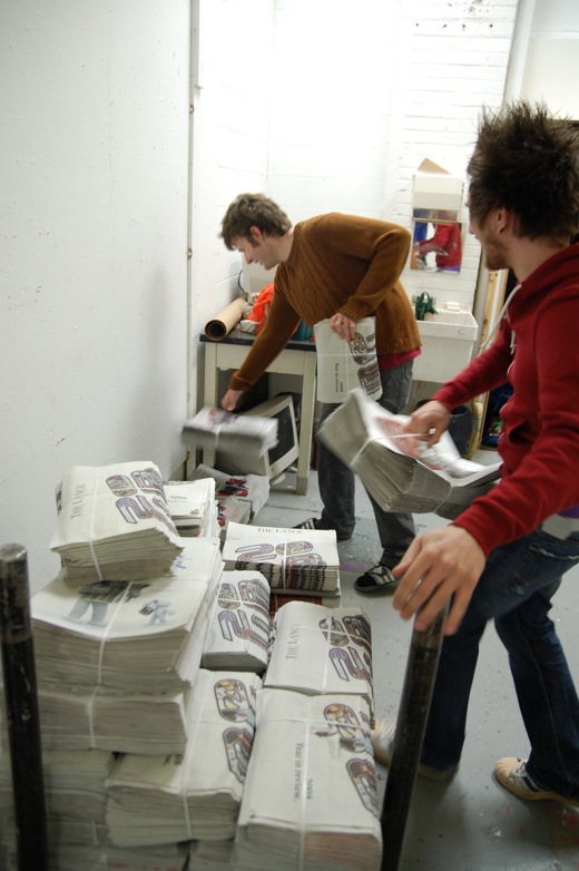 Stacking newspapers in my studio