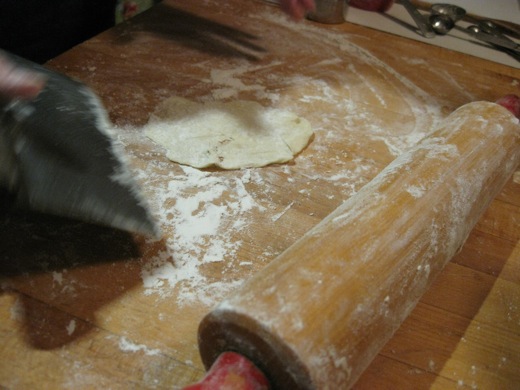 we briefly thought using a rolling pin might help to get the dough flatter, but it just stuck to the pin