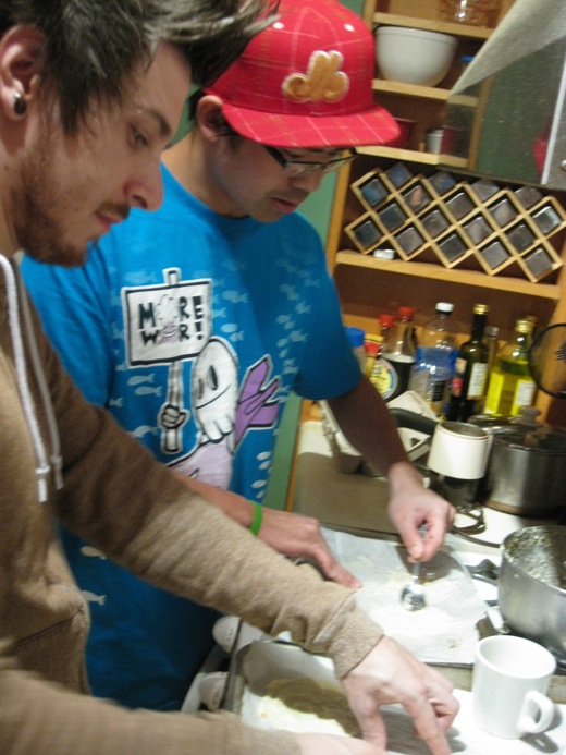 Justin and Immony working on packing as many fortune cookies as possible on one sheet