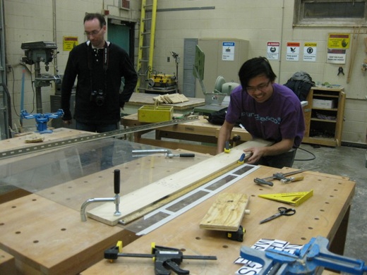 Immony clamps the plexiglass in the University of Windsor woodshop