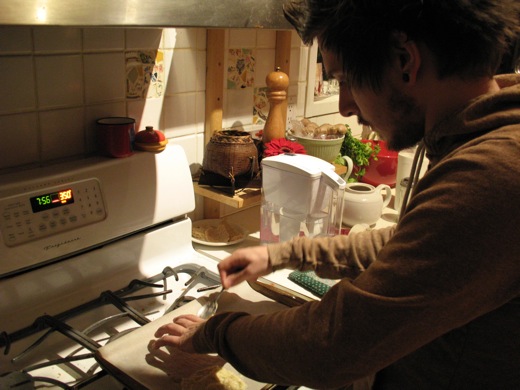 Justin trying to get as many fortune cookies on a baking sheet as possible