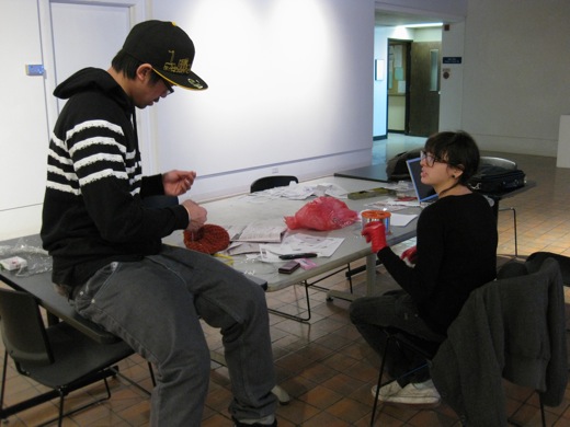 Immony and Danielle working on the hanging baskets