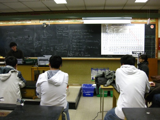 physics club, brainstorming on the chalkboard