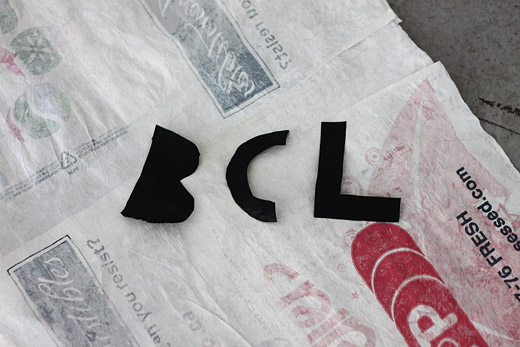BCL in garbage bag letters