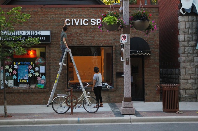 Installing some signage on the exterior wall of CIVIC SPACE (1)